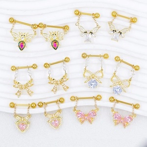 Golden butterfly and bee nipple rings set with crystals and pearls on white background