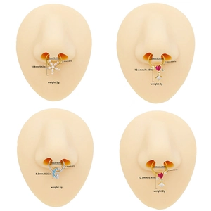 Set of stainless steel septum rings with heart and moon designs on silicone models
