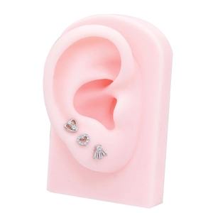 Three-piece set of silver heart and fan-shaped cubic zirconia stud earrings on ear model
