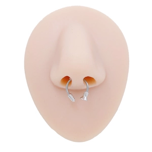 Detail view of silver horseshoe septum ring with textured screw and funnel ends
