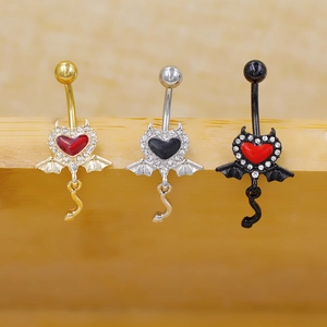 Gold and silver devil heart navel rings set with wings and zircon accents