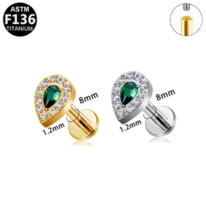 F136 titanium teardrop labret studs with green stone and cubic zirconia halo