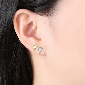 Kite-shaped G23 titanium stud earrings with sparkling cubic zirconia in gold and silver