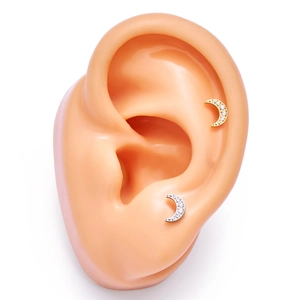 G23 titanium crescent moon ear cartilage stud with zircon crystals on silicone model