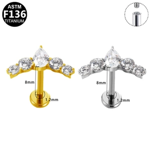 Macro detail of F136 titanium internally threaded labret studs with teardrop zircon gems
