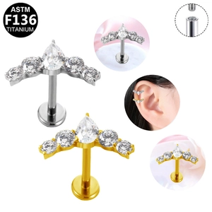Macro detail of F136 titanium internally threaded labret stud with fan-shaped cubic zirconia