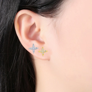 F136 titanium sword and star stud earrings in gold and silver set on ear cartilage