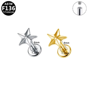 Macro detail of F136 titanium star studs showing internal thread and 1.2x8mm size