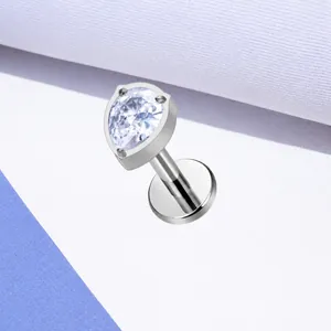 Detailed view of F136 titanium labret featuring a pear-shaped cubic zirconia in a 3-prong setting