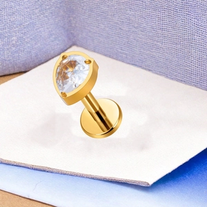 Macro shot of F136 titanium gold labret with marquise zircon and flat back post