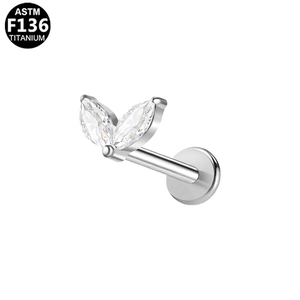 Detailed macro view of F136 titanium labret stud with two marquise-cut zircon stones