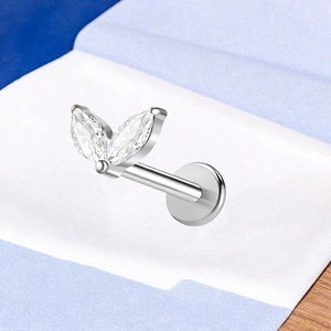 Macro view of silver F136 titanium labret stud with marquise cubic zirconia leaves