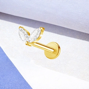 Macro shot of titanium threadless labret with marquise cut zircon in leaf design