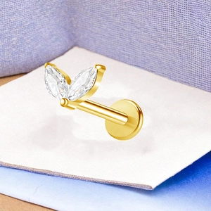 Macro shot of gold titanium marquise zircon stud showing leaf design and flat back post