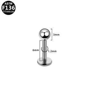 Detail of ASTM F136 titanium piercing stud with 3mm ball and flat back design
