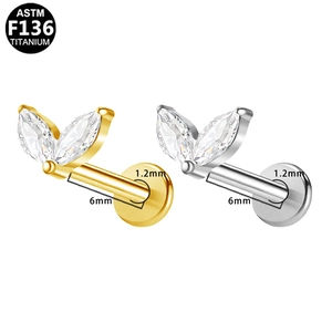 Detail view of F136 titanium labret studs with marquise zircon stones and 1.2mm size markings