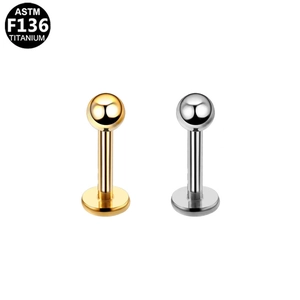 Detailed comparison of ASTM F136 titanium piercing studs in gold and silver finishes