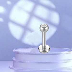 Detailed close-up of F136 titanium stud earring with a clear cubic zirconia stone