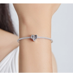 Close-up of S925 sterling silver mesh bracelet with heart-shaped MOM engraved charm