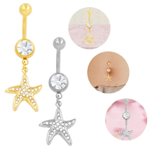 Detailed view of starfish belly button rings with sparkling crystals in gold and silver