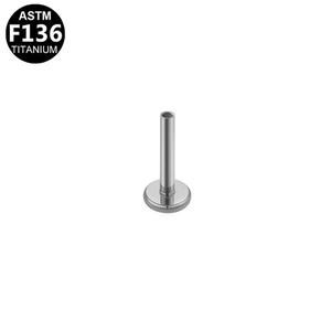 Macro detail of ASTM F136 titanium labret back base with internal threading for piercing