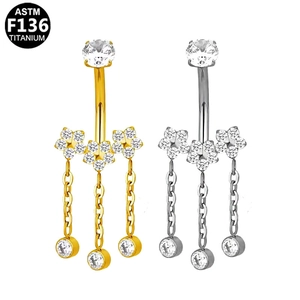 Piercing para ombligo de titanio con flores de circón y borlas en oro y plata