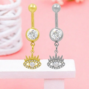 Detail of evil eye navel rings with cubic zirconia lashes in gold and silver finish