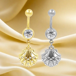 Detailed view of gold and silver navel rings with seashell pendants on silk