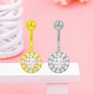 Detalle de piercings para el ombligo en oro y plata con circonitas cúbicas transparentes