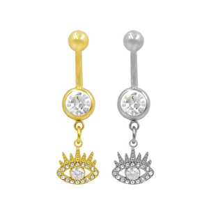 Detailed view of silver and gold belly rings with evil eye charms and zircon accents