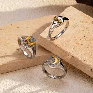 Three-piece signet ring set in polished silver and 18k gold finish with celestial icons
