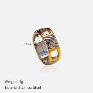 Detail of two-tone stainless steel cross ring with 17mm inner diameter and 4.2g weight