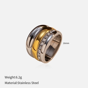 Detail view of two-tone stainless steel crossover ring with sparkling round cubic zirconia