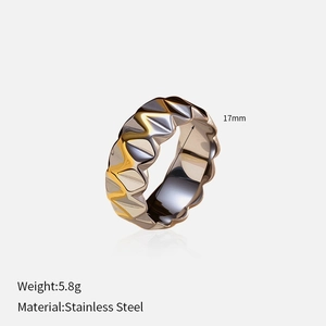 Detail of 18k gold plated stainless steel wave ring with two-tone silver and gold finish