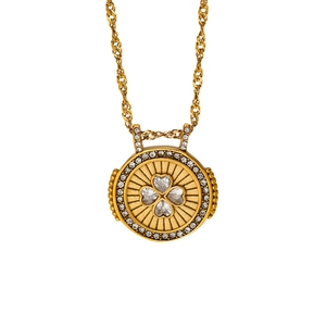 Collier trèfle doré avec cristaux scintillants sur une chaîne à mailles torsadées