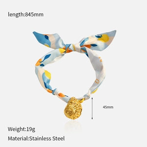 Detail of silk scarf necklace with lemon print, shell pendant, and technical dimensions