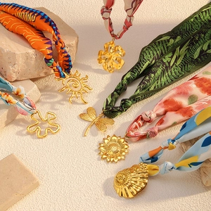 Elegant stainless steel scarf necklaces with assorted gold pendants and colorful silk prints