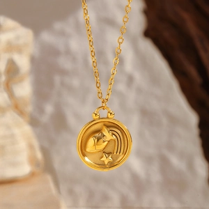 Close-up of gold-plated Aquarius constellation round pendant on an O-chain necklace