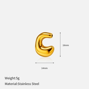Macro detail of a 18mm gold stainless steel C-shaped charm with measurements and weight