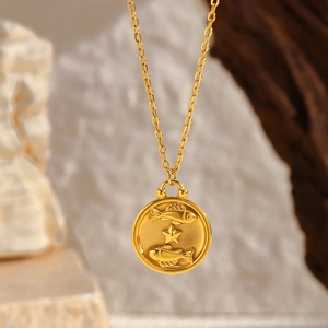 Detailed close-up of gold plated stainless steel zodiac necklace with Pisces pendant
