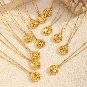 Detail of 12 zodiac gold coin necklaces with embossed patterns on stainless steel