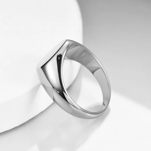 Polished stainless steel 12mm flat top ring in silver finish on stone display
