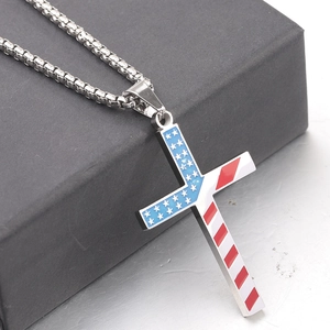 Macro detail of 50mm stainless steel cross pendant with American flag drip oil pattern