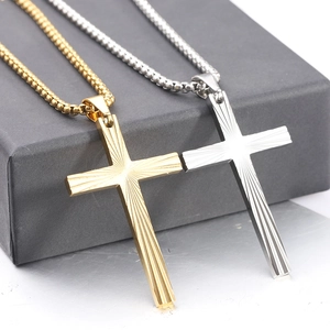 Detail of 50mm vintage cross pendant with radial grooves in gold and silver finish