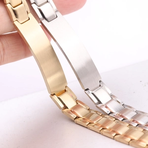 Close-up of dual-tone 12mm brushed stainless steel bracelets in gold and silver finish