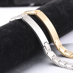 Close-up of 12mm brushed stainless steel bracelets on a black velvet display