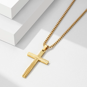 Detail of 50mm gold stainless steel cross pendant with radial striped texture and box chain