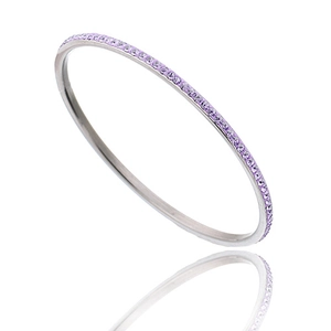 Close-up of slim silver stainless steel bangle with a full row of lavender crystals