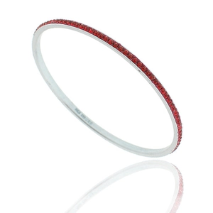 Macro detail of S925 sterling silver bangle with row of sparkling red zircons