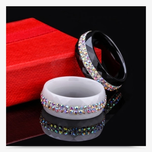 Detail view of 8mm ceramic rings with dual rows of rainbow rhinestones and diamond facets